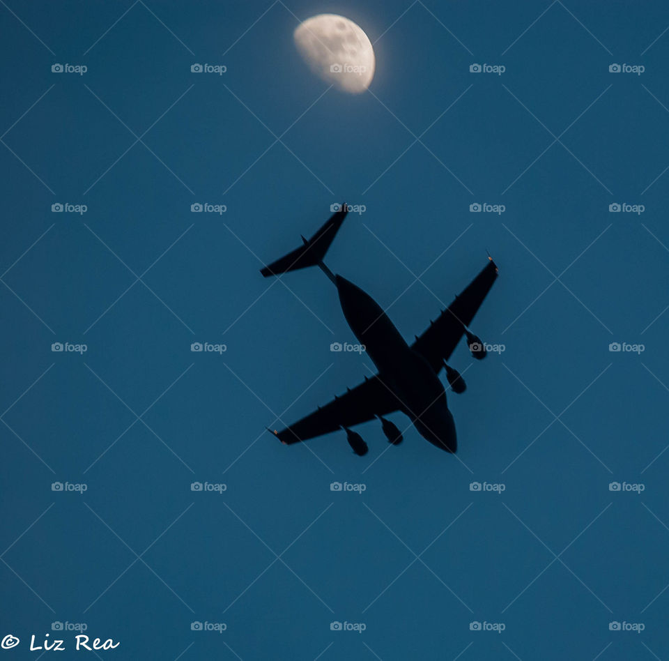 Plane across the moon