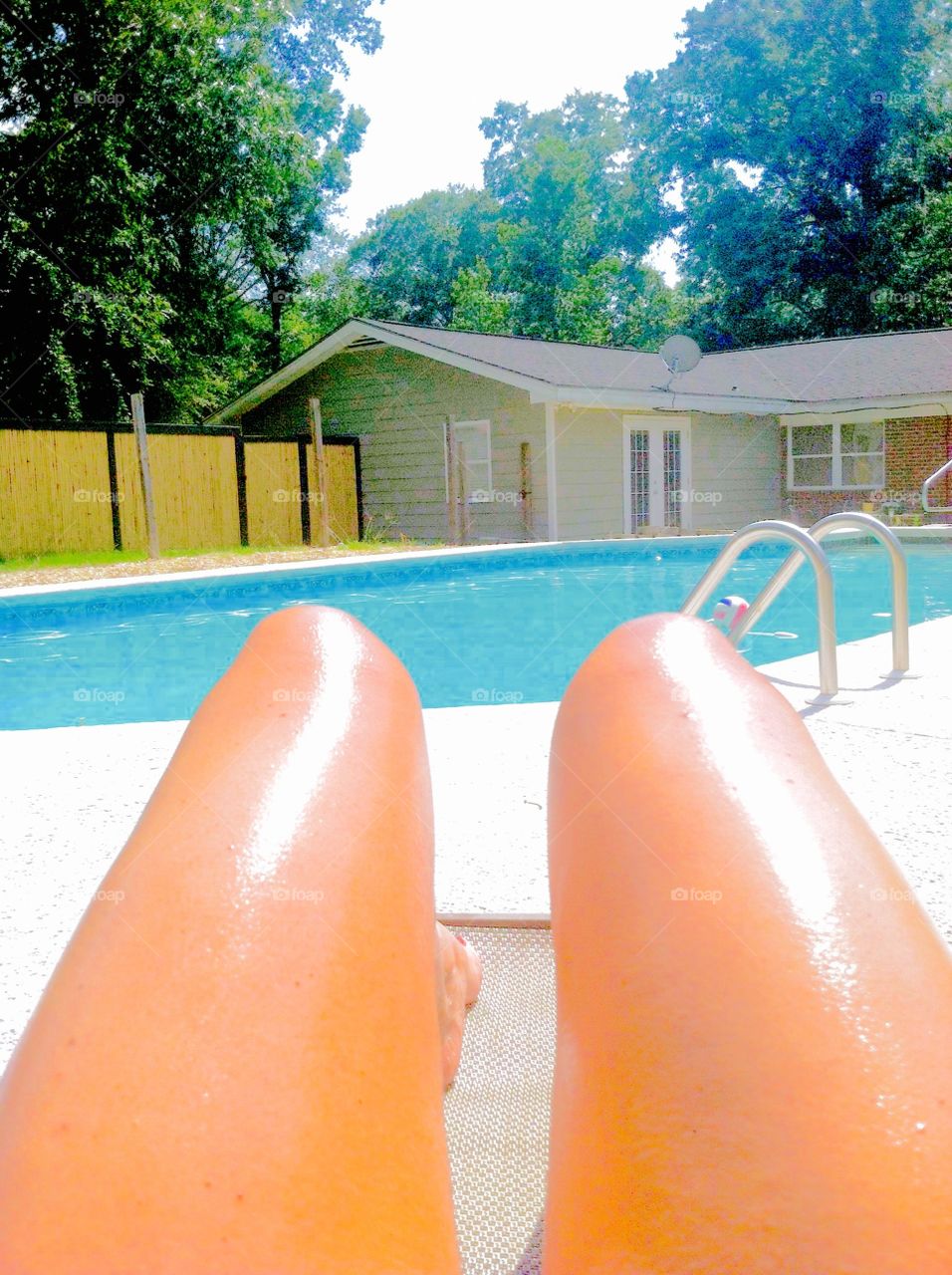 Pool time . Sunbathing by the pool legs look like two hotdogs 