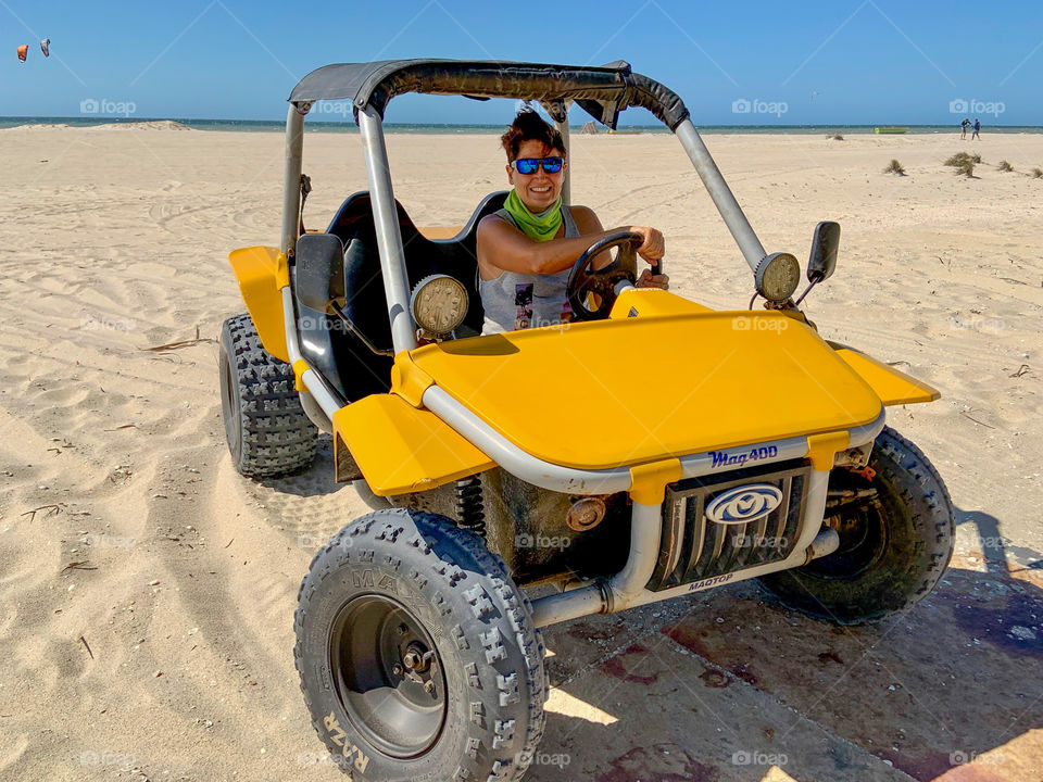 Woman in a yellow mini buggy 