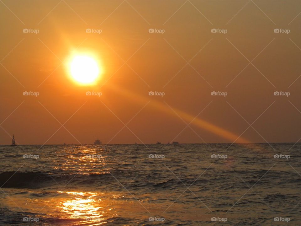 Glowing Sun above Water Ocean