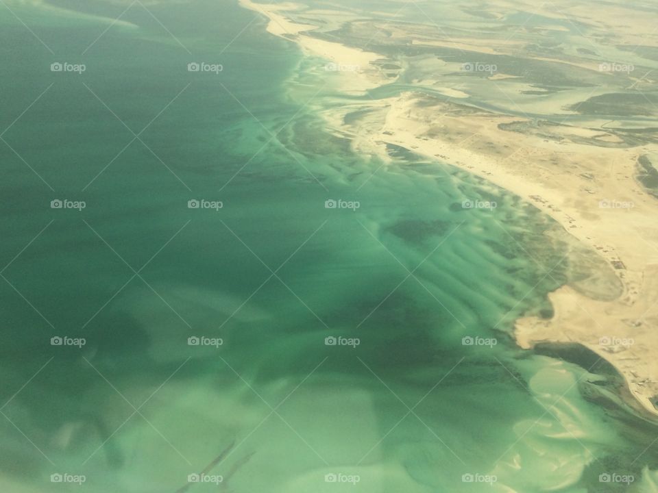 Arial view of water body meeting land @ Abu Dhabi
