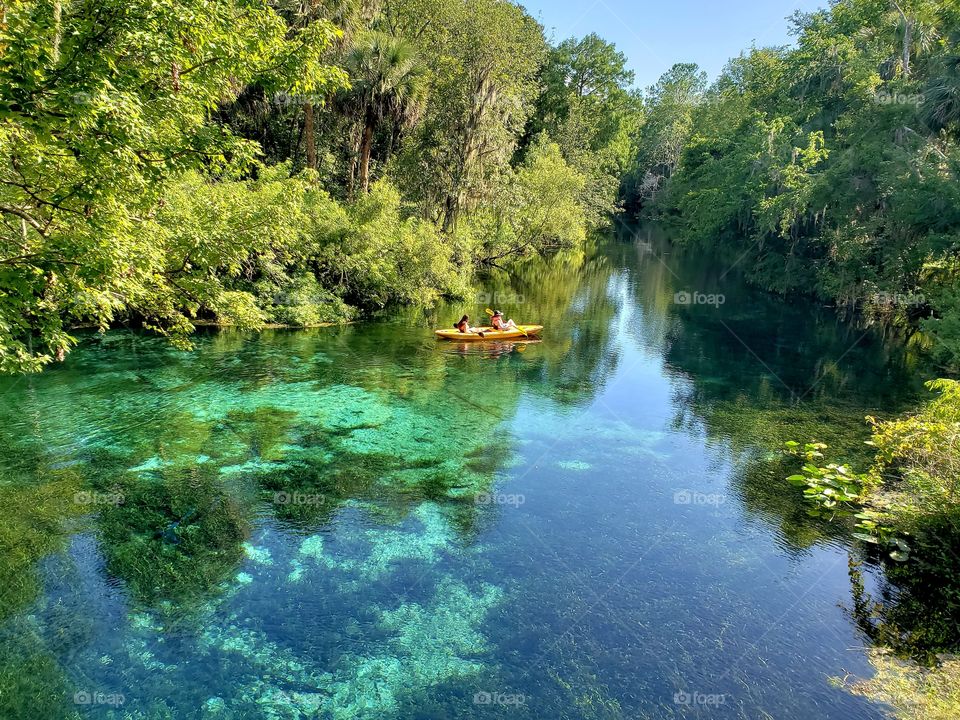 Clear blue waters of Silver Springs Florida. Kayaker enjoying the spring.