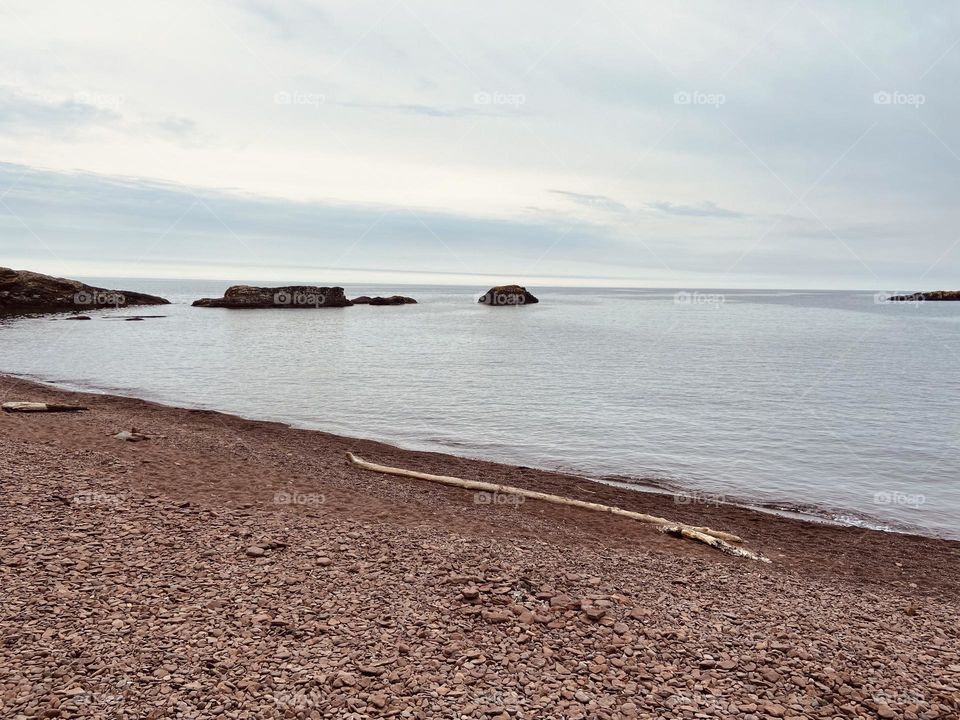 Sandy beach on the shores of Lake Superior in the upper peninsula of Michigan- Copper Harbor