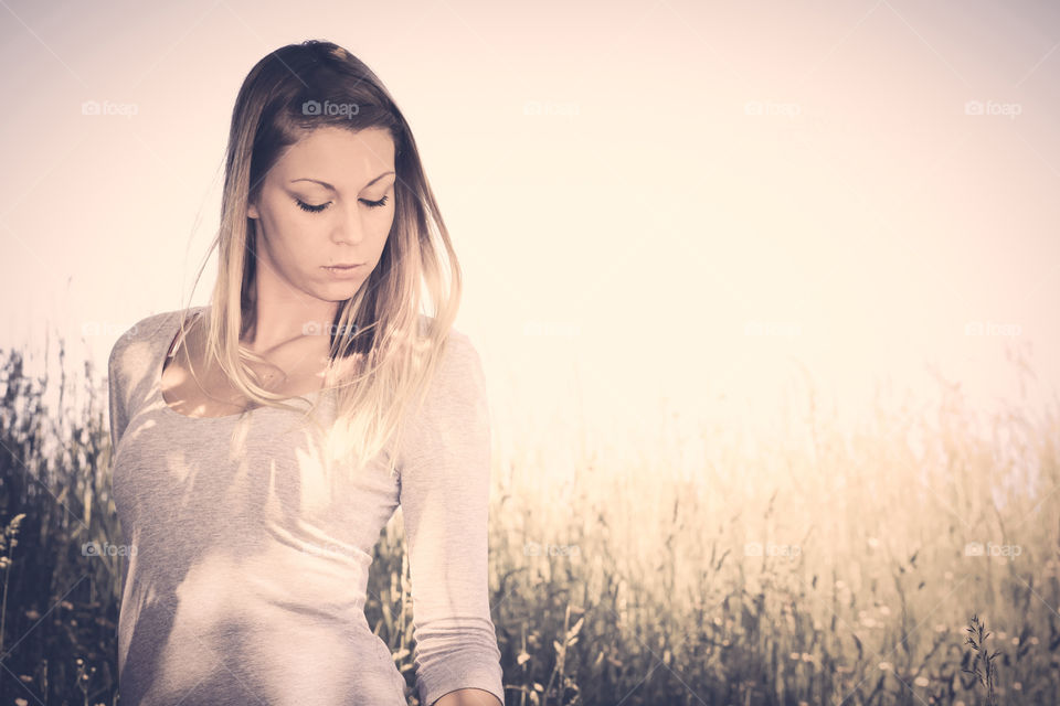 Woman standing near field