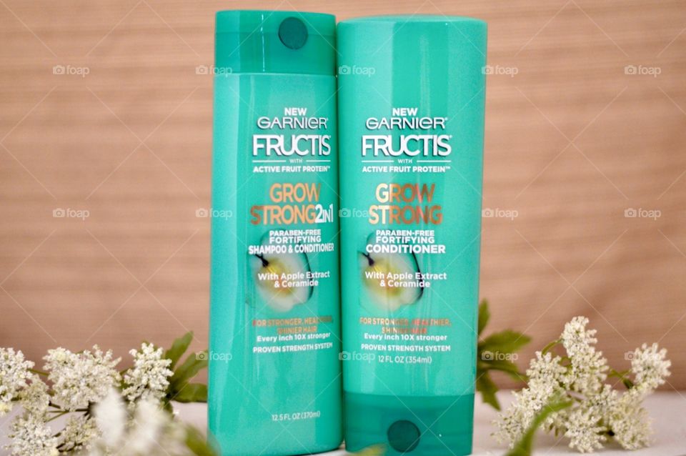 Garnier grow strong conditioner and shampoo Flat lay on a background