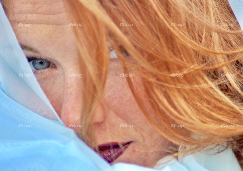 Gorgeous blue eyed redheaded woman with freckles!