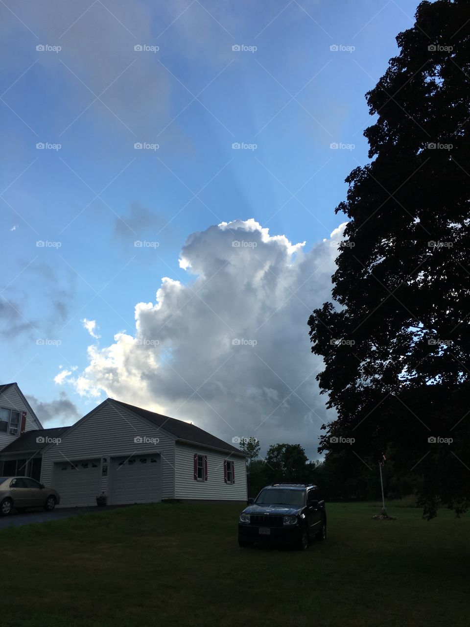 Bright clouds over the house