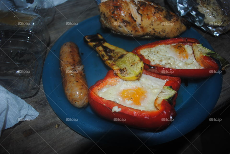 Grilled peppers with eggs, zucchini and sausage