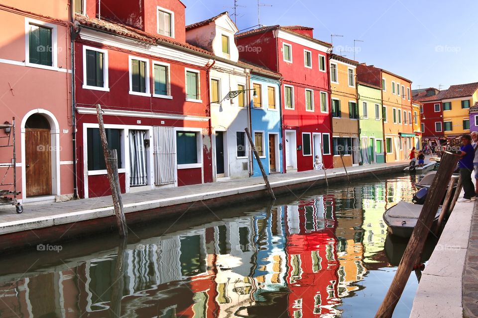 Colorful houses with reflection in the river