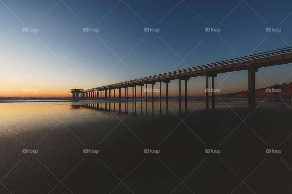 The Pier. Sunset photograph of a concrete pier, overlooking the Pacific Ocean.