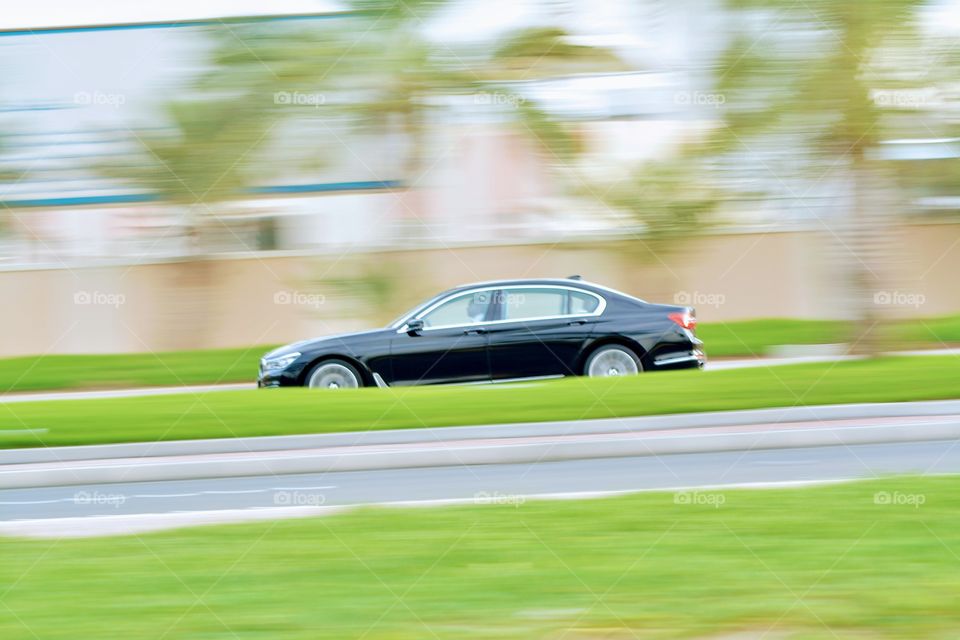 Speeding car , panning photography 