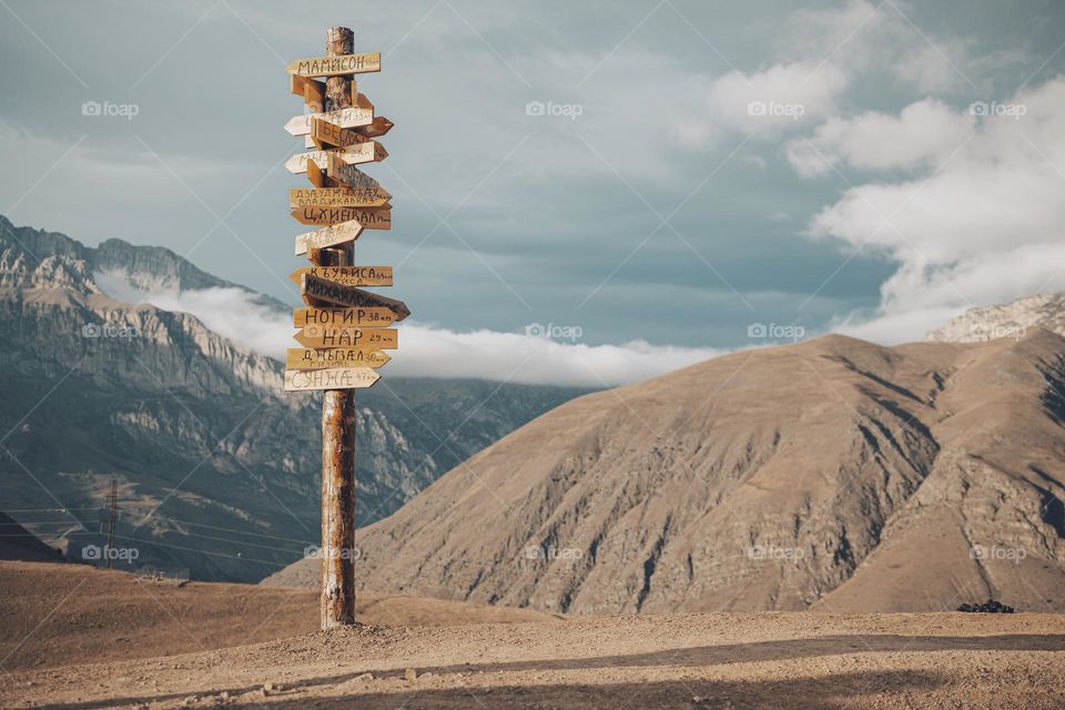 Travel waymark on the top of mountain