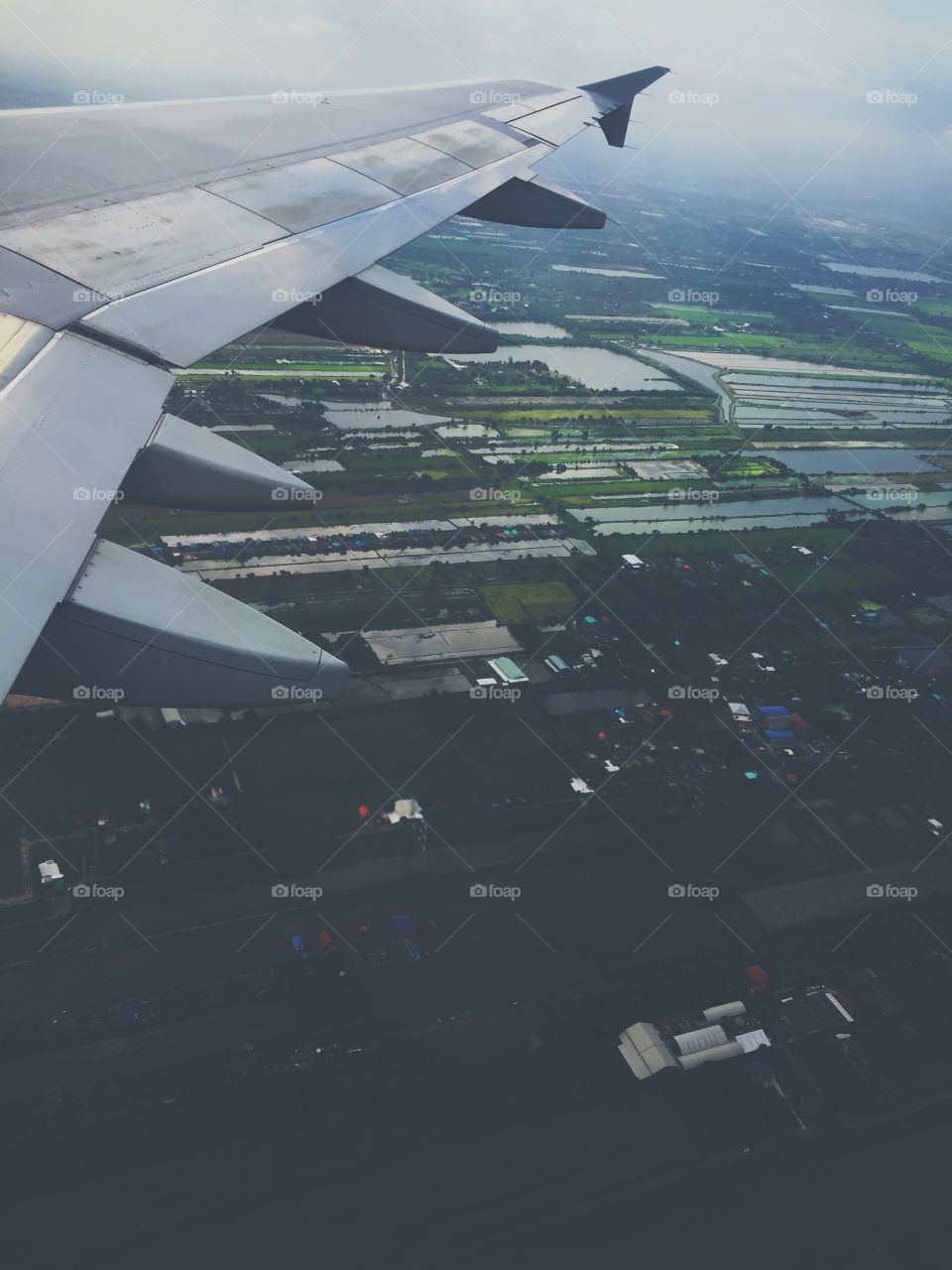 Airplane window view during takeoff in Bangkok airport, Thailand 