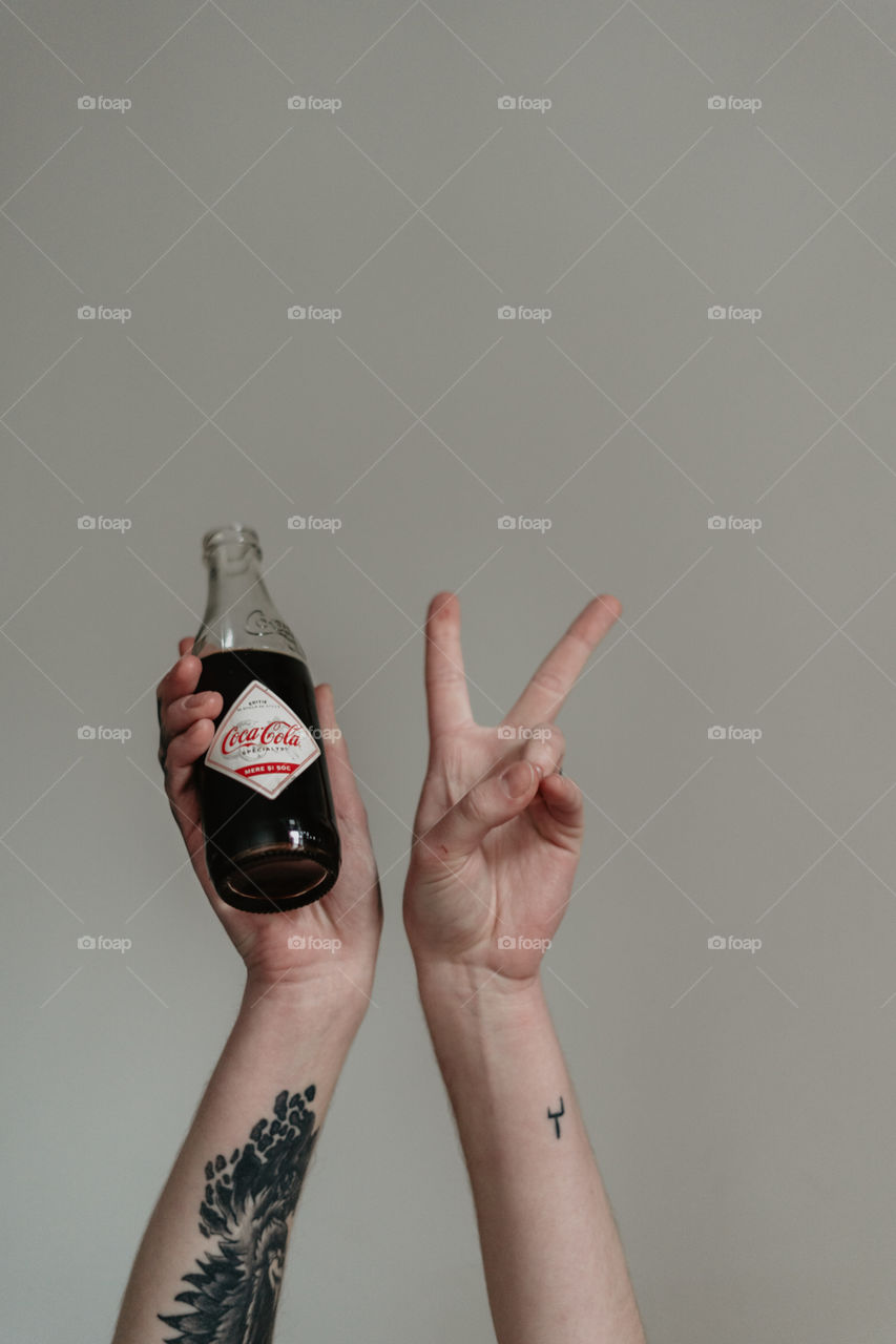 hands and coca cola 