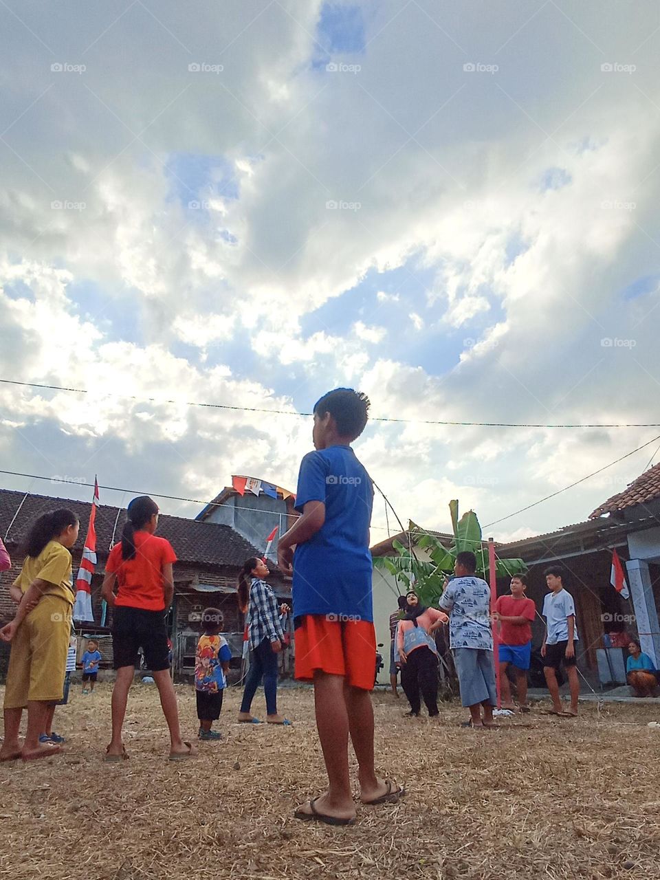 Portrait of enthusiastic children participating in activities to celebrate Indonesian Independence Day in the field in the afternoon