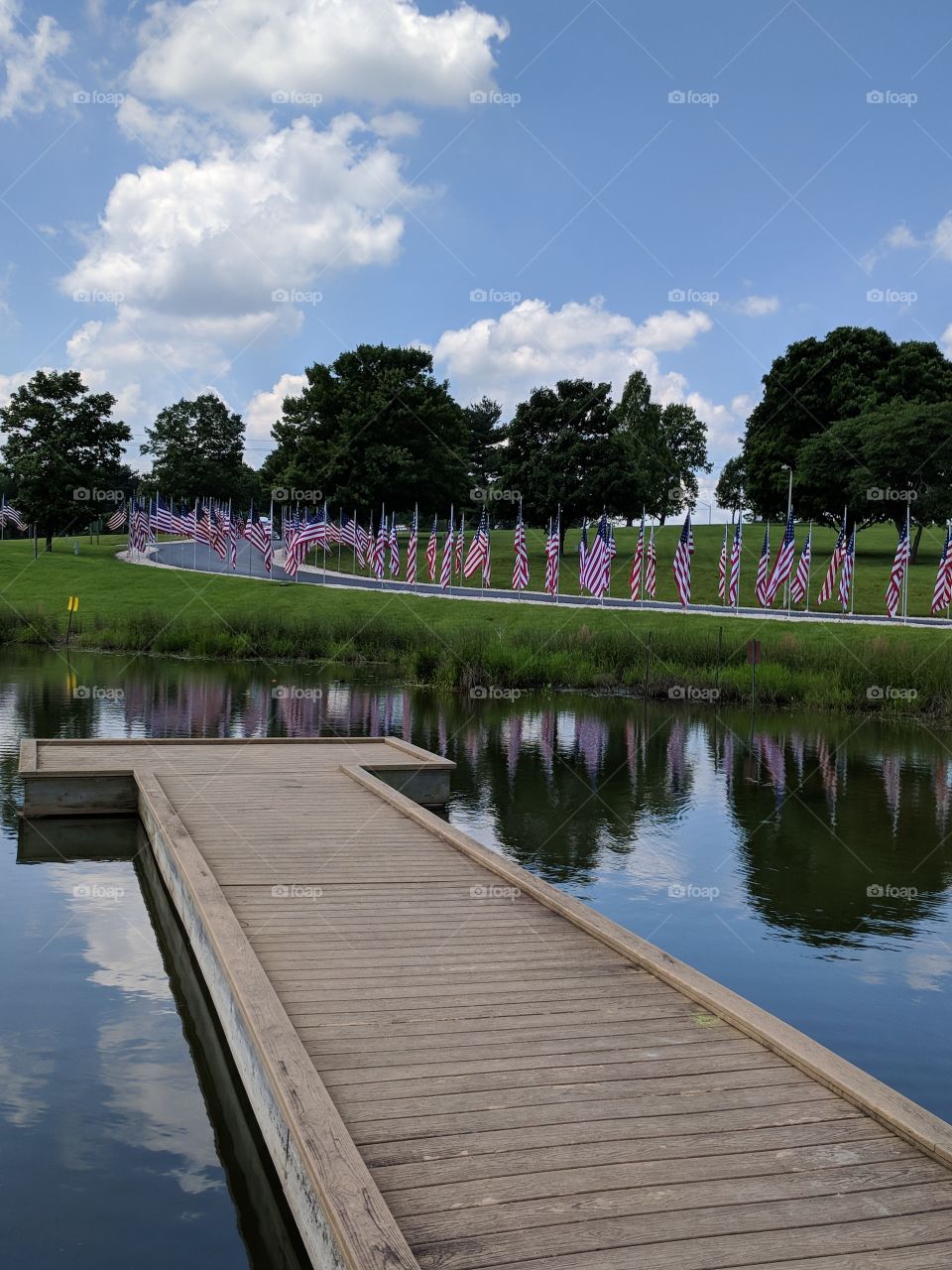 Reflection of flags on the water on memorial day 2018