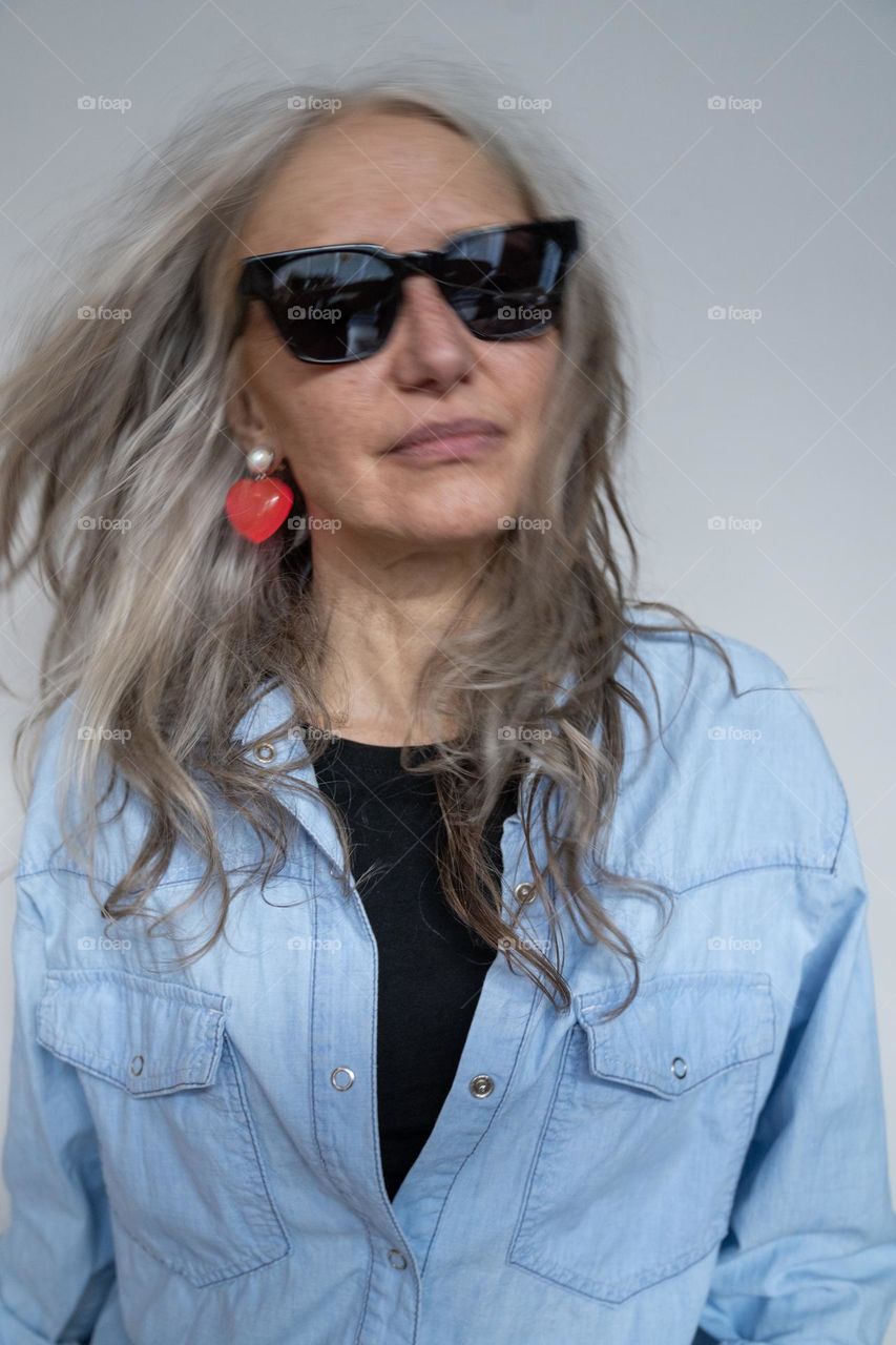 Stylish mature model wearing sunglasses 