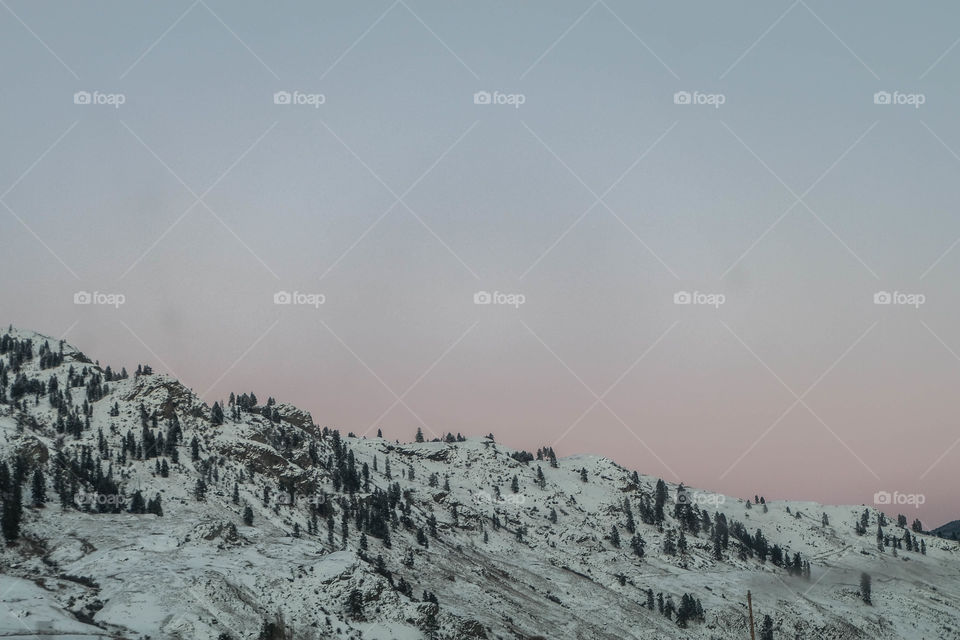 Evening glow over snowy mountain