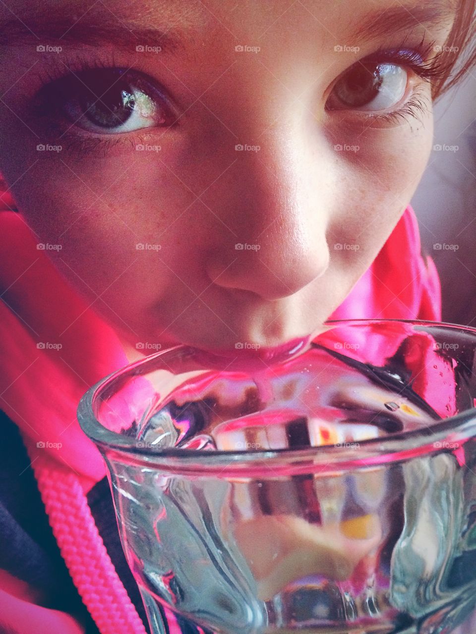 Drinking. Girl drinks a glass of water