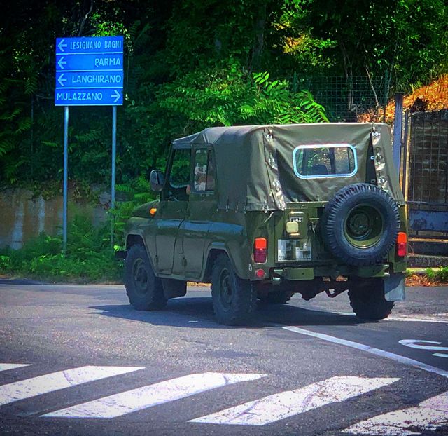 Cars.  On the road is a car "UAZ"