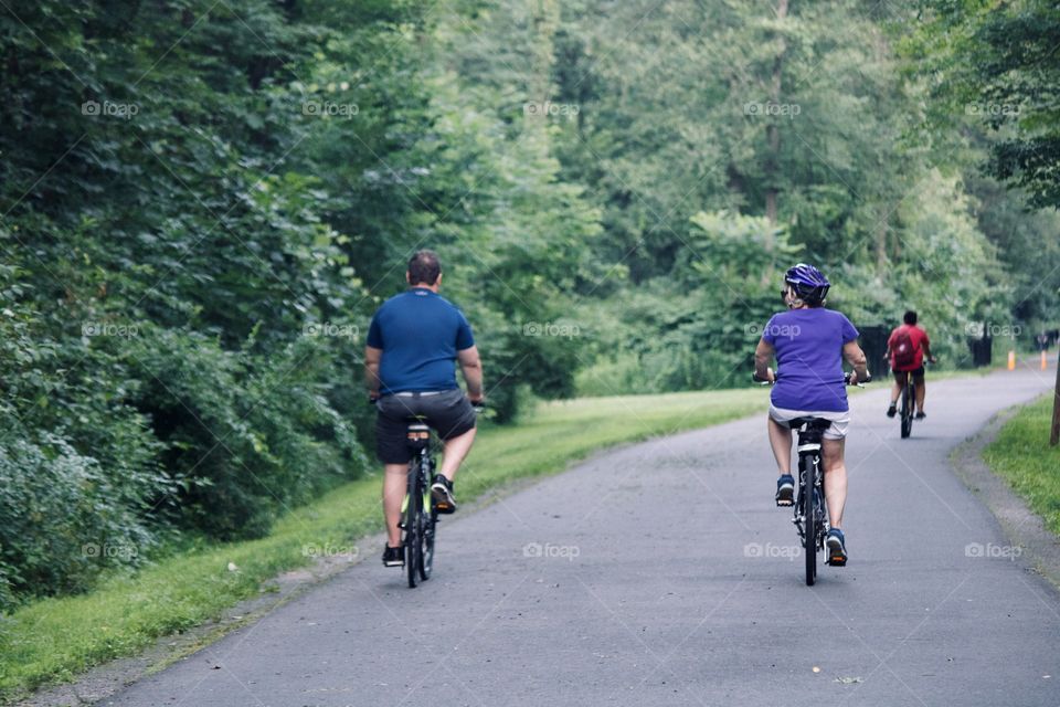 Couple bicycling during the evening 