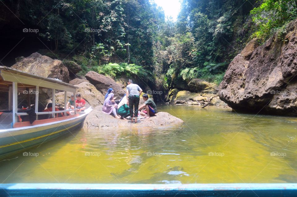 Pulo Gulamo, Kampar-Riau, Indonesia. 
It is a famous destination for Pekanbaru people to do travel, camp, outdoor exploring and boating. Most people call it as Riau green canyon because of rocks sides, clean water, green, forest and reservoir