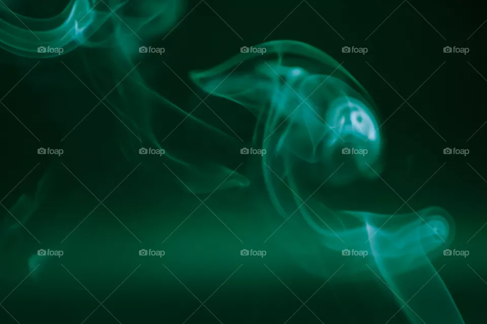 Smoke scented candles on a black background