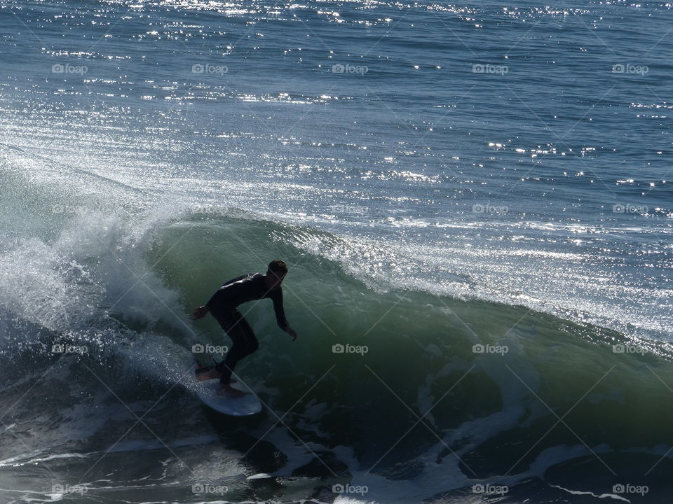 Surfer catching the curl 