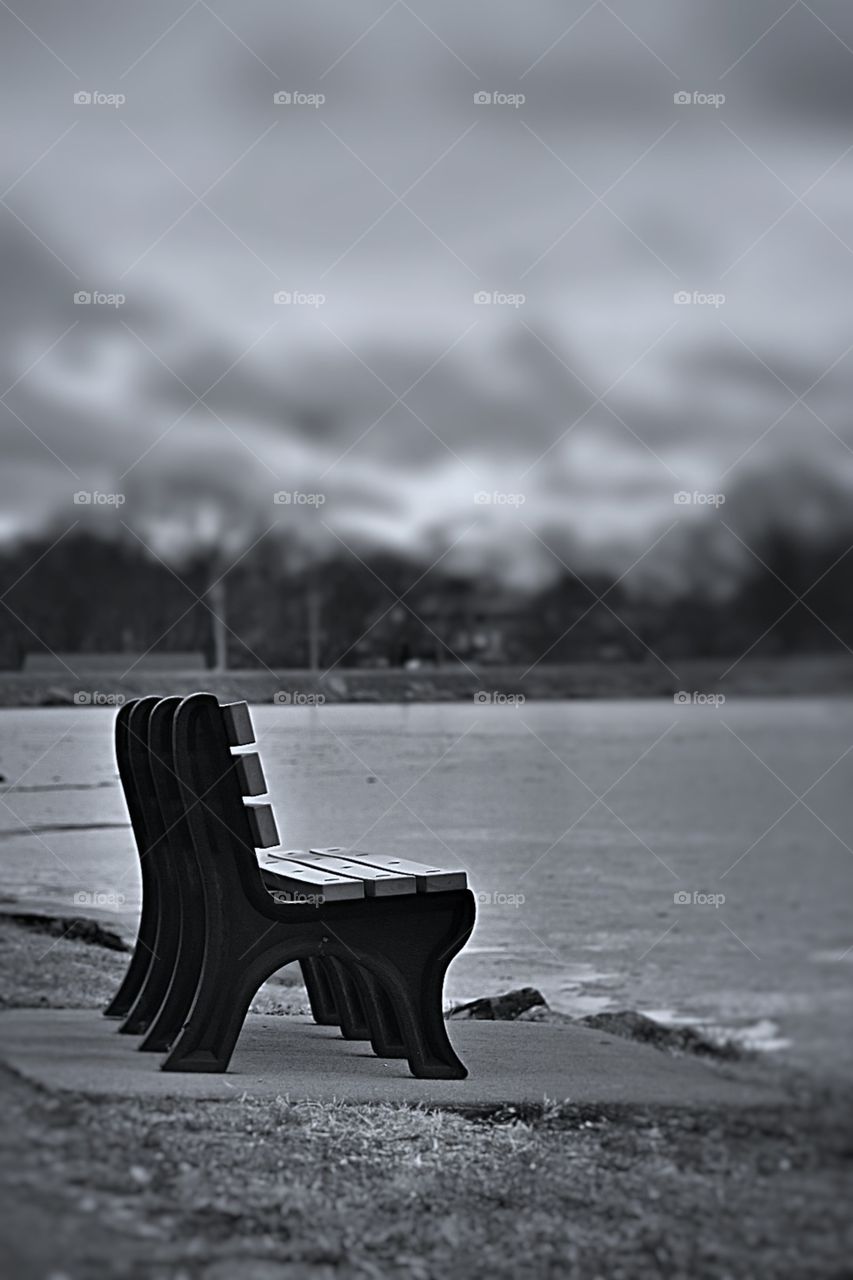 A lone bench by the lake