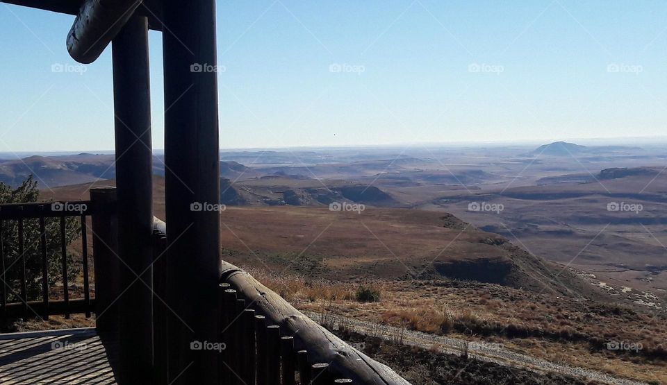 the view from a mountain cabin on a sunny morning.