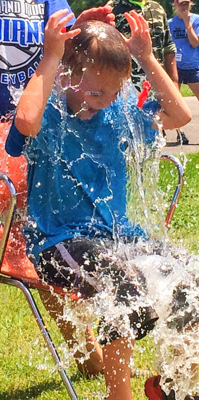 Popped water balloon over head 