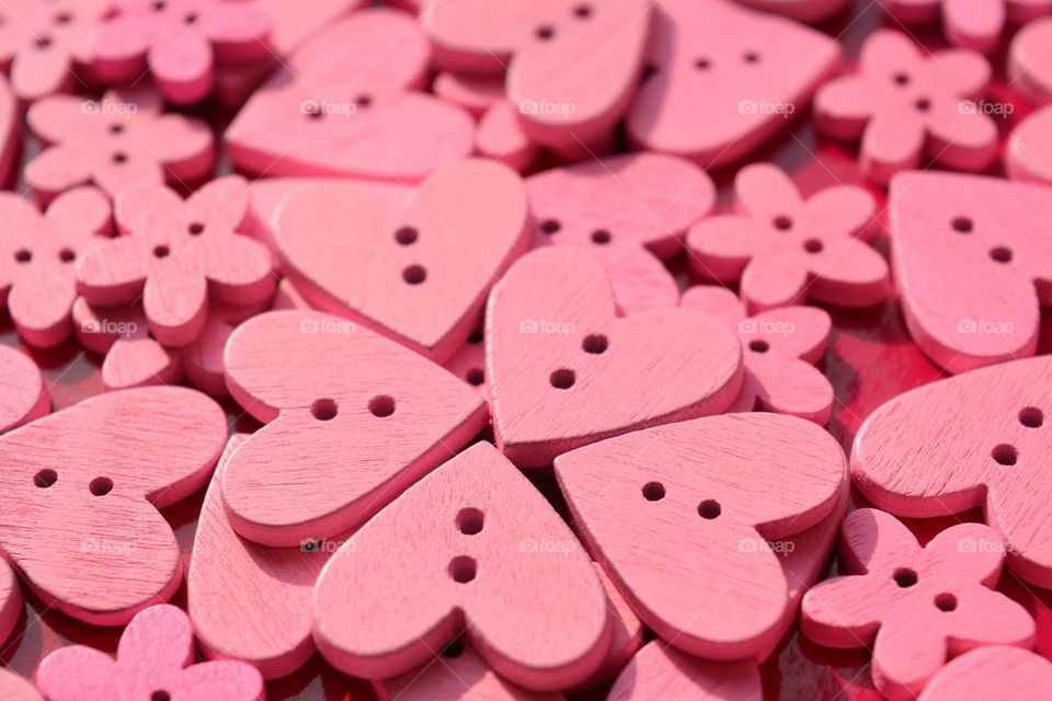 Close-up of pink hearts buttons