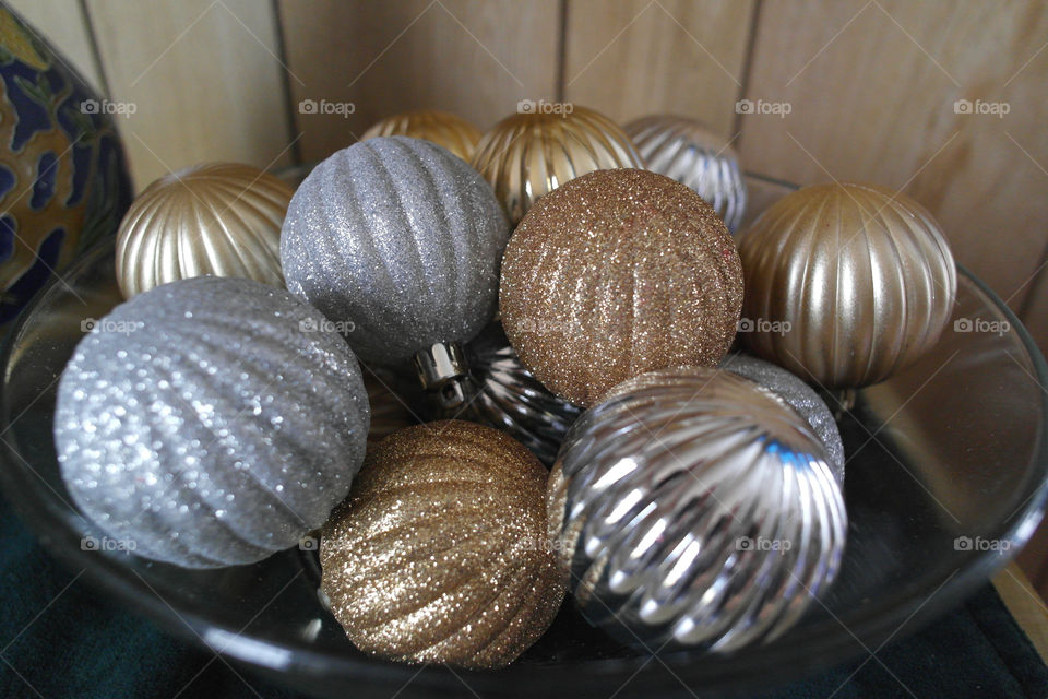 Gold and silver decorations in a bowl