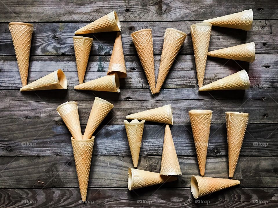 Love you text made from ice cream cones on wooden table