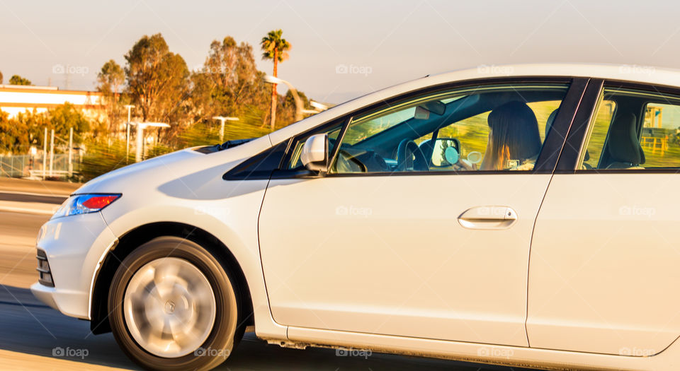Girl applying make up while driving