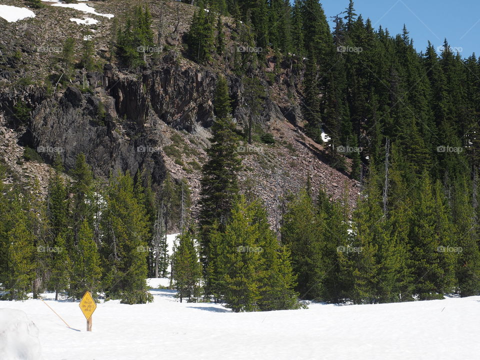 Deep snow remains high up in Oregon’s Cascade Mountains even in June on a sunny summer day. 