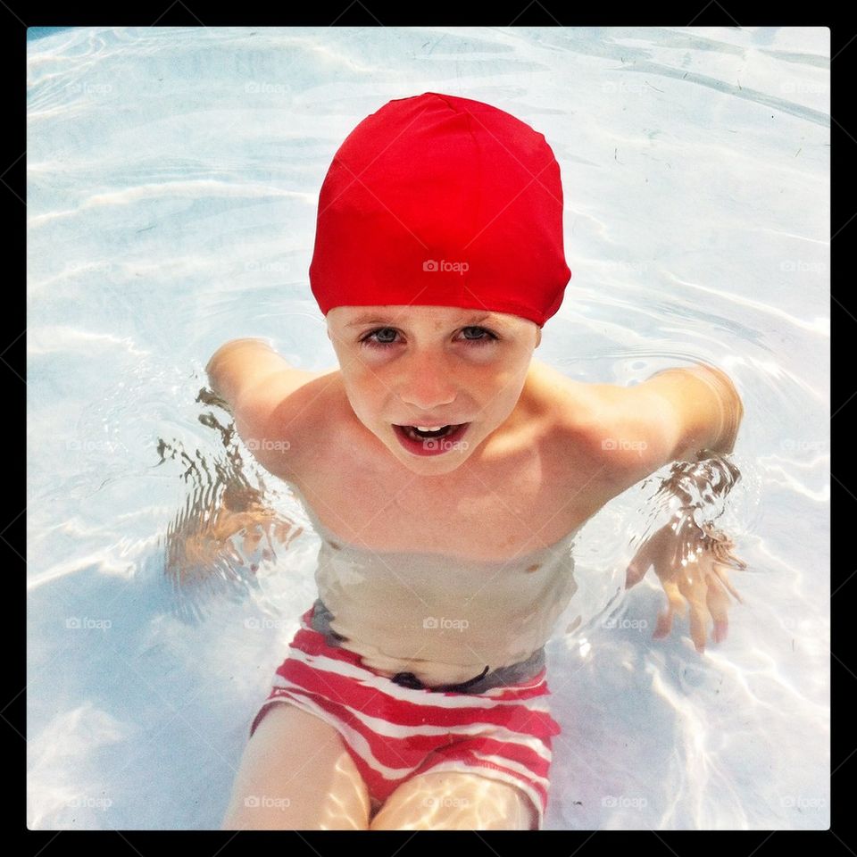 Boy in a swimming pool