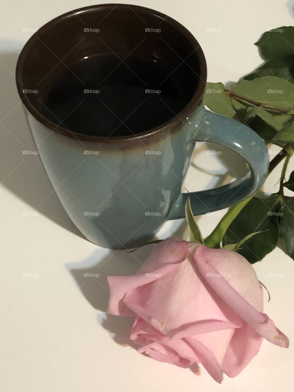 Coffee and pink rose