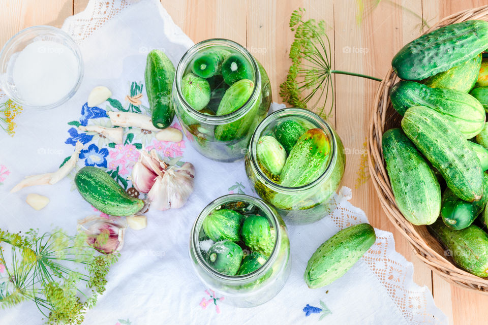 Pickling cucumbers. Pickling cucumbers with home garden vegetables and herbs