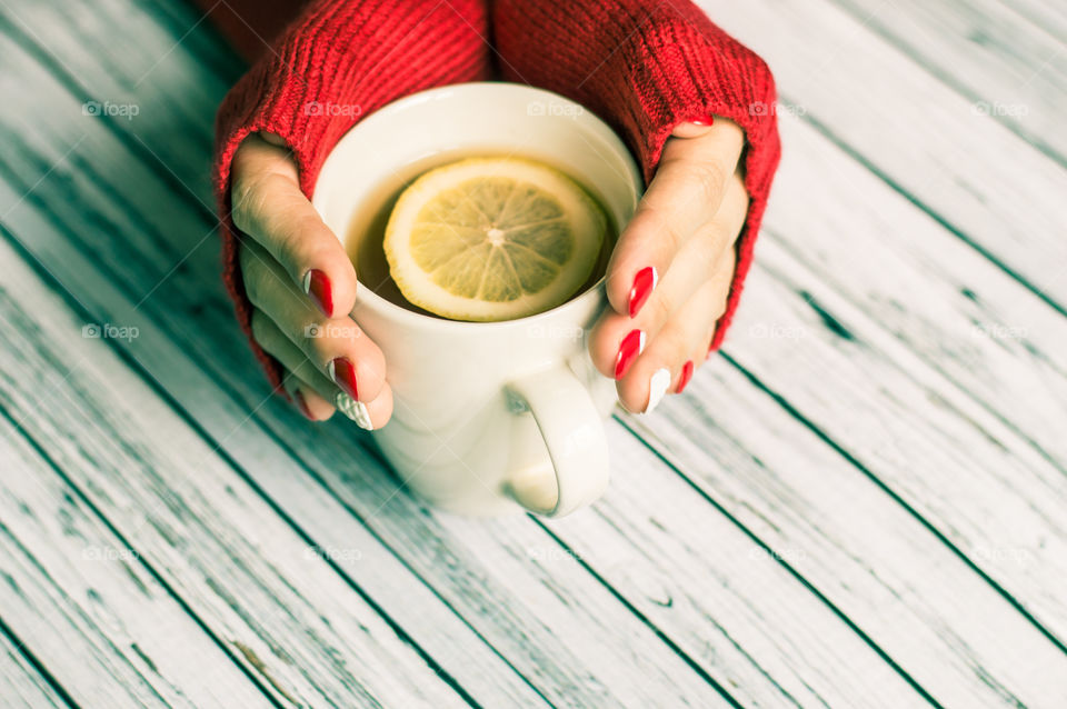 woman hand with cup of tea