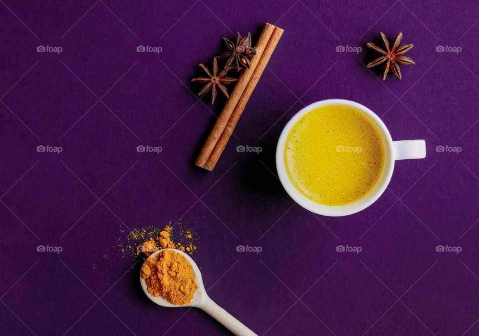 Top view to cup with golden milk.