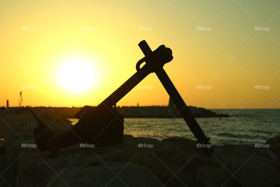 anchor. isolated anchor at sunset