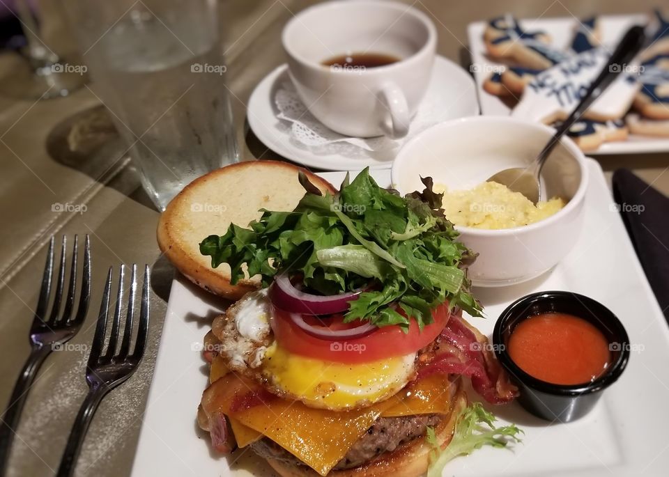 Even the nicest restaurants serve burgers, topped with arugula with a side of grits.