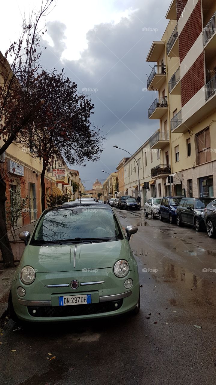 Fiat in a rainy day, on the streets of Alghero