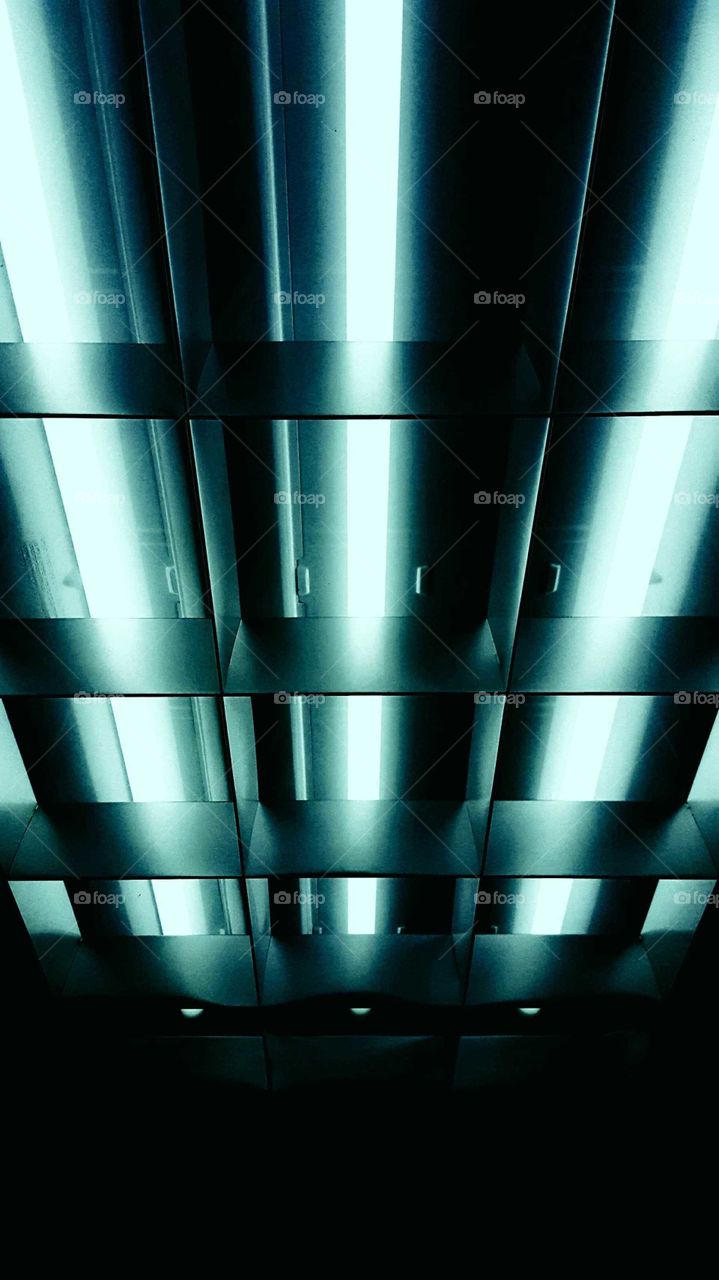 a futuristic looking light with a Light Grid in front of it