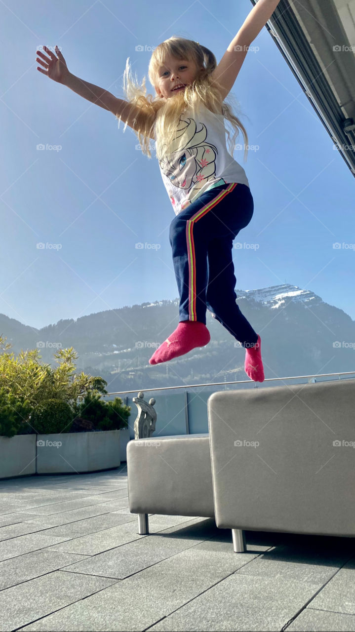 blonde girl jumping