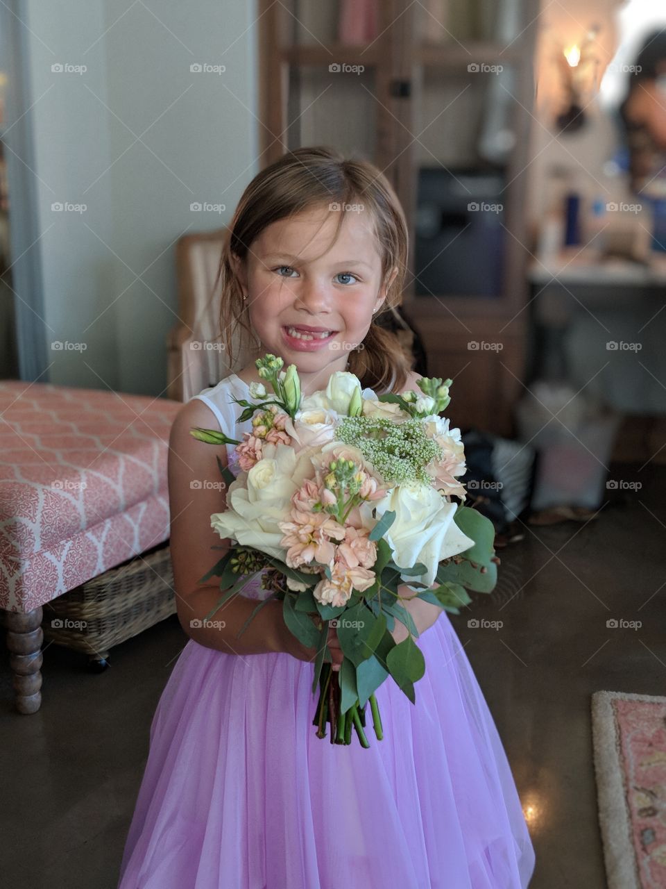 little girl just as happy as the engaged bride.