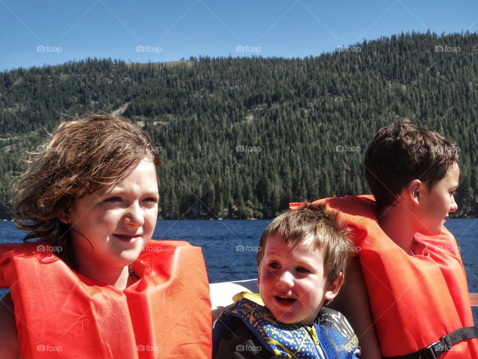 Kids Boating On A Mountain Lake
