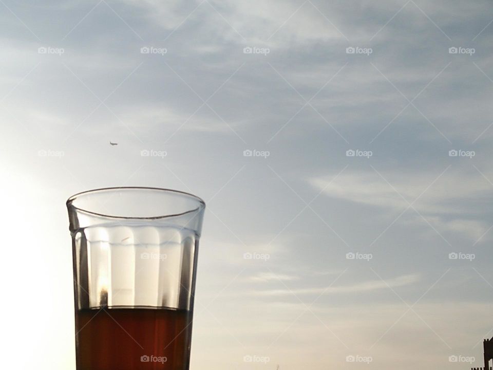 Beautiful cup of tea embraced foggy sky.