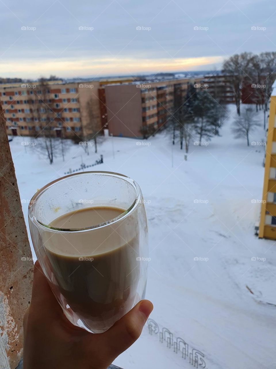 Hot cup of coffee on a cold winter morning.